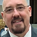 Meet Jon Price: The High School Debate Coach Who Helps Students Find Their Voice While Earning Awards Along the Way